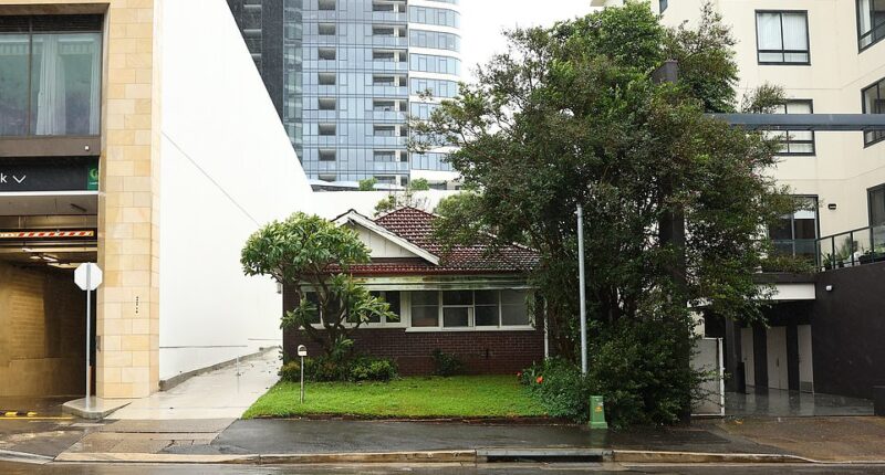 The only single-storey house left on Walker Street in Rhodes. The owner has refused to sell to developers because they wouldn't give her $20million