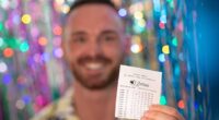 An Australian couple have become an overnight multi-millionaires after winning $20 million in an Oz Lotto draw. Pictured is a stock image of a man holding an Oz Lotto ticket