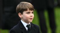 Prince Louis, six, grins cheekily as young royal accepts chocolates and stuffed animals from royal fans at Sandringham