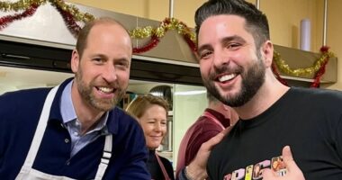 Prince William dons an apron as he serves Christmas dinner at The Passage - a homelessness charity he first visited with Princess Diana