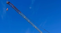 A crane dangling above a house has sparked debate over renters' rights