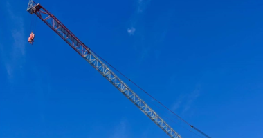 A crane dangling above a house has sparked debate over renters' rights