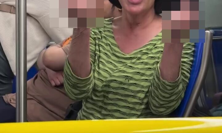 Shock moment ‘racist’ traveller launches foul rant at photographer & family before she’s kicked off plane transfer bus