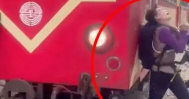 Shocking moment oblivious tourist is hit by train while taking selfie in front of screaming onlookers in Taiwan