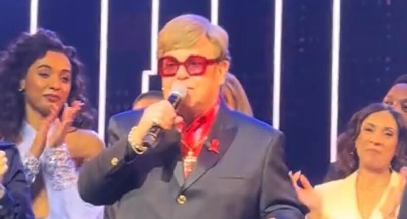 Sir Elton John tells West End crowd 'I've lost my eyesight and cannot see the stage' - but tells The Devil Wear Prada cast they 'sounded great' before being led off by husband David Furnish amid his sudden battle with blindness