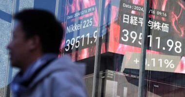 Stock market today: Asian shares are mixed after Nasdaq sets a record ahead of Fed meeting