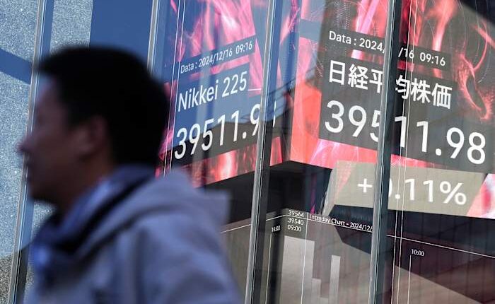 Stock market today: Asian shares are mixed after Nasdaq sets a record ahead of Fed meeting