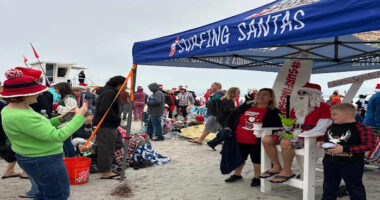 Surfing Santas & CPR: Holiday tradition teams up with local charity to save lives