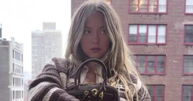 Sydney Sweeney goes shirt-free on a rooftop after hitting back at trolls for slamming her bikini body