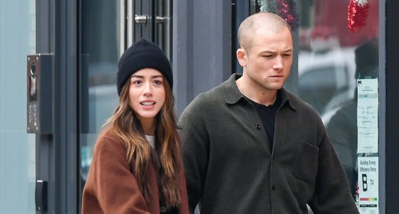 Taron Egerton and new Marvel star girlfriend Chloe Bennett wrap up warm as they enjoy romantic stroll in NYC - just days after confirming romance