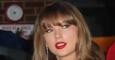 Taylor Swift holds hands with Travis Kelce as couple enjoys another romantic night out in rainy NYC