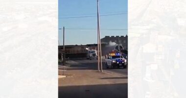 Texas train derails after hitting tractor-trailer, barrels into city building: video