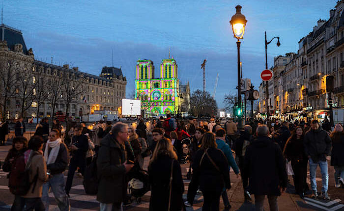 The Latest: The famed Notre Dame Cathedral in Paris reopens to great fanfare