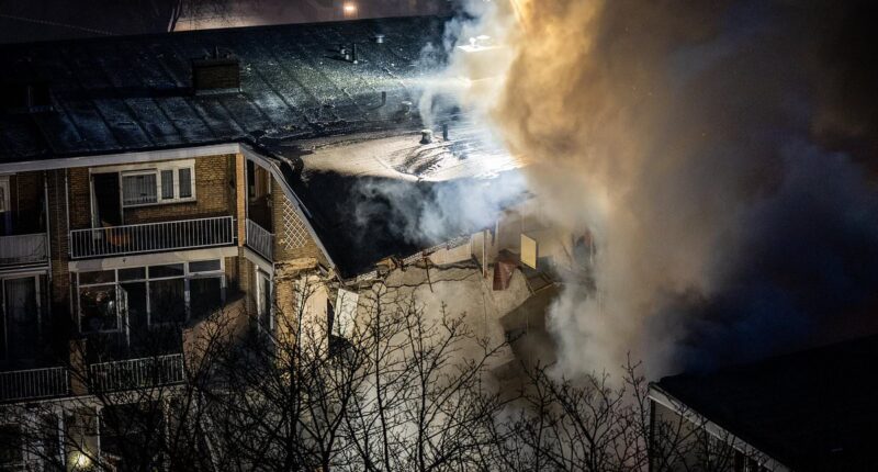 Three-storey apartment block collapses after explosion in the Hague as emergency workers search for survivors under the rubble