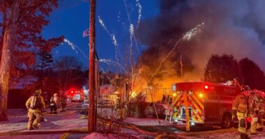 Watch terrifying moment barrage of fireworks launch from huge house blaze as firefighters battle inferno