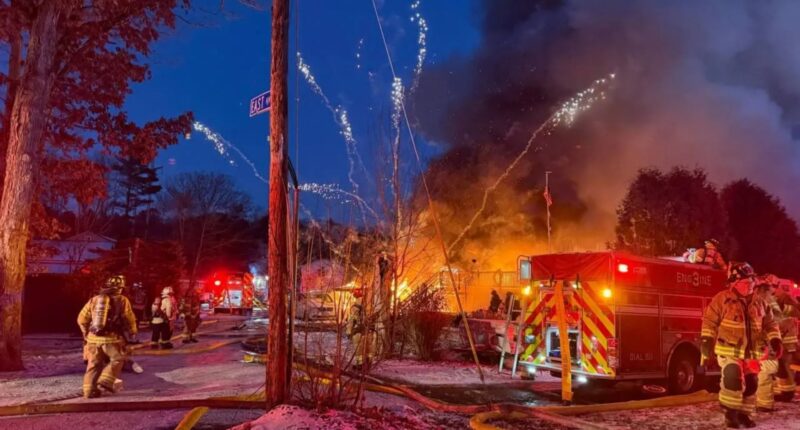 Watch terrifying moment barrage of fireworks launch from huge house blaze as firefighters battle inferno