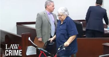 Woman accused of killing terminal husband smiles in court