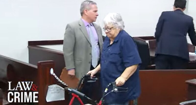 Woman accused of killing terminal husband smiles in court