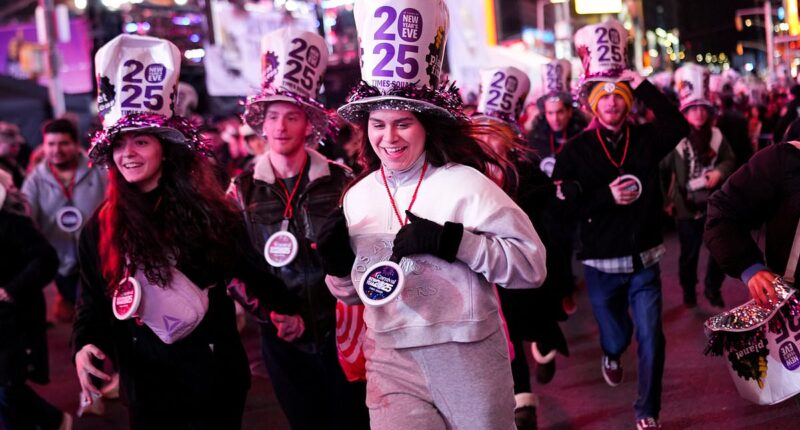 America ends 2024 in style! Thousands descend on Times Square to welcome in the New Year (despite fears of a washout)