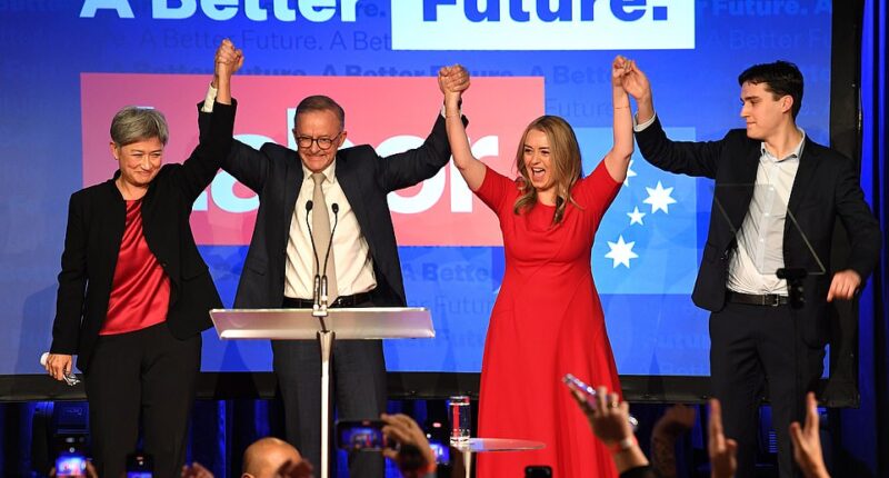 Anthony Albanese (pictured with Penny Wong, girlfriend Jodie and son Nathan) has declared 'Aussies have voted for change' after securing a historic election win - and also blasted rowdy supporters in his victory speech