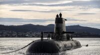 The Australian Navy has banned China and Russia from a major international military summit in a bitter snub amid rising global tensions. Pictured: Royal Australian Navy submarine HMAS Sheean