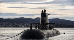 The Australian Navy has banned China and Russia from a major international military summit in a bitter snub amid rising global tensions. Pictured: Royal Australian Navy submarine HMAS Sheean