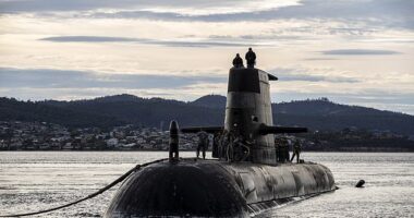 The Australian Navy has banned China and Russia from a major international military summit in a bitter snub amid rising global tensions. Pictured: Royal Australian Navy submarine HMAS Sheean