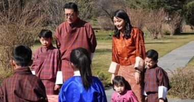 Bhutan's glamorous Queen Jetsun Pema makes rare public appearance alongside her three children to mark New Year