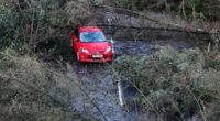 Britain pummelled by 80mph gales and torrential rain as people told 'do not travel' amid punishing conditions that have closed roads and railways in the aftermath of Storm Eowyn