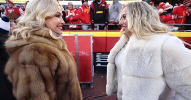 Brittany Mahomes puts on glam display in chic fur coat as she kisses husband Patrick at AFC Championship