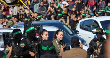 Chilling moment Hamas thugs parade four female hostages as they’re surrounded by gun-wielding terrorists before release