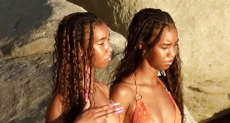 Diddy's twin daughters, 18, look carefree in St Barts as 'monster' father spends miserable New Year's in jail