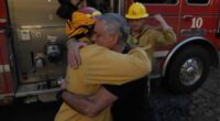 Emotional moment Palisades homeowner breaks down in tears when he finds his house miraculously escaped damage and hugs the firefighters who saved it 