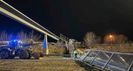 Fencing, roof of Anchorage pedestrian bridge fall in strong wind, closing highway