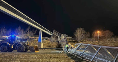 Fencing, roof of Anchorage pedestrian bridge fall in strong wind, closing highway