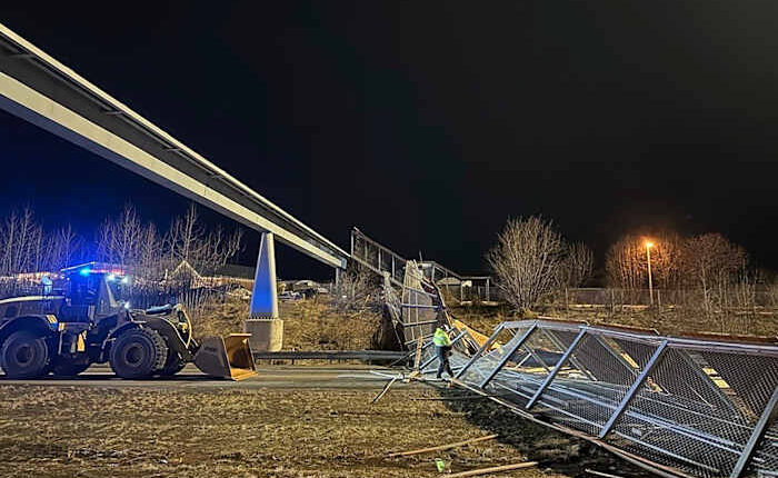 Fencing, roof of Anchorage pedestrian bridge fall in strong wind, closing highway