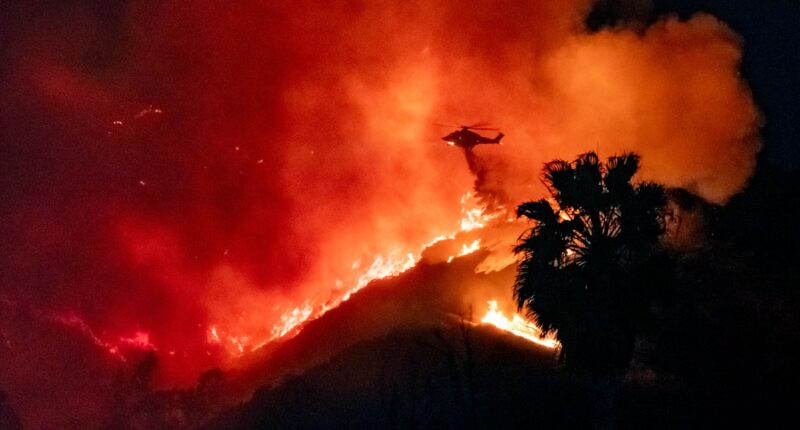 Hollywood Boulevard is evacuated as wildfires erupt in celebrity epicentre: Another 100,000 told to escape NOW as horror images show LA neighbourhoods reduced to ashes and death toll rises