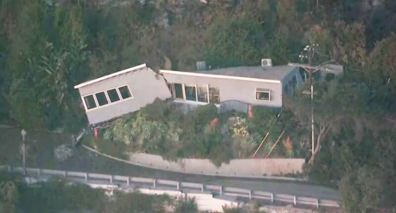 Home that survived LA blaze is split in HALF by mudslide triggered by firefight as water and debris barrel down hill