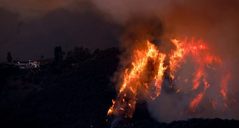 LA wildfires roar towards more celeb-packed enclaves with 6 blazes STILL out of control as 70mph winds set to fan flames