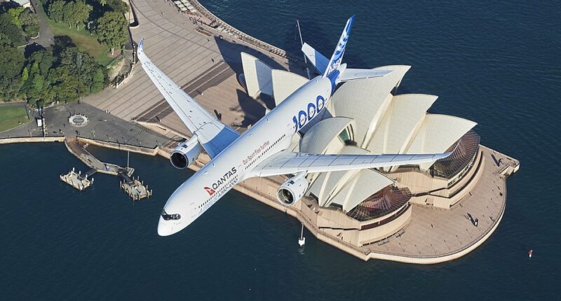 An Airbus A350-1000 flight test aircraft flies over the Sydney Opera House to mark a major fleet announcement by Australian airline Qantas (pictured)