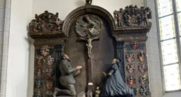 Mysterious 400-year-old cache of ancient treasure found hidden crammed inside leg of STATUE in church