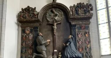 Mysterious 400-year-old cache of ancient treasure found hidden crammed inside leg of STATUE in church