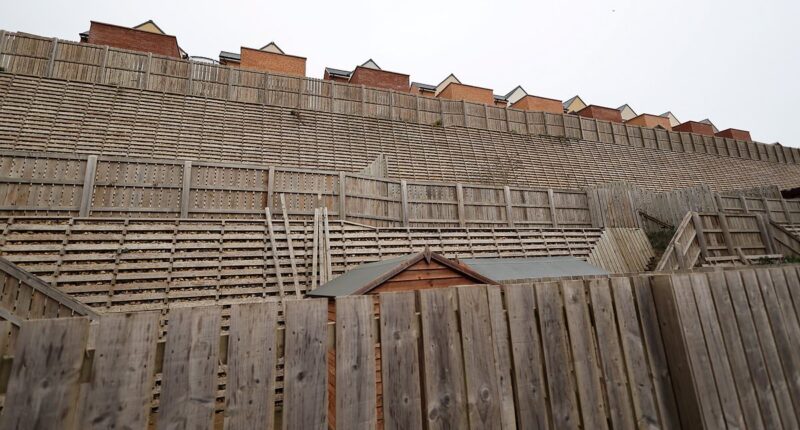 Our £180k newbuild homes are mocked because of our giant 40ft 'privacy' fence...snobs have compared it to the TITANIC