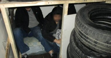 People smugglers JAILED after trying to sneak men into the UK crammed in makeshift den underneath pile of dirty tyres