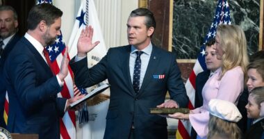 Pete Hegseth's seven children watch on as he's sworn in as Defense Secretary