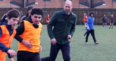 Prince William enjoys a football game during visit to youth hub in Toxteth - and makes a light-hearted joke about his skills