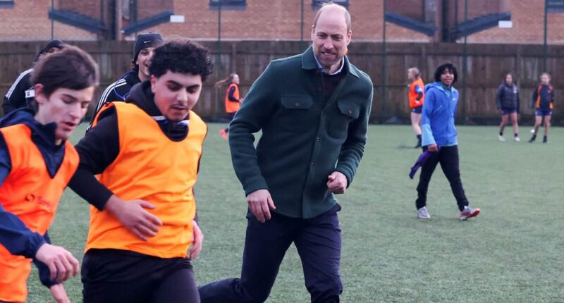 Prince William enjoys a football game during visit to youth hub in Toxteth - and makes a light-hearted joke about his skills