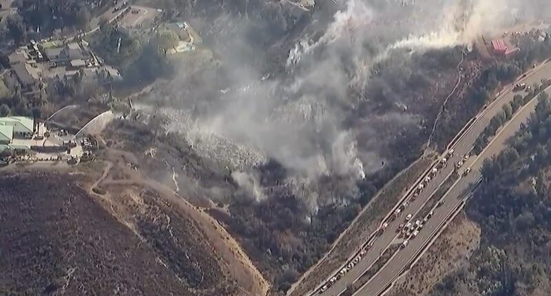 Residents evacuated as brush fire threatens homes near San Diego