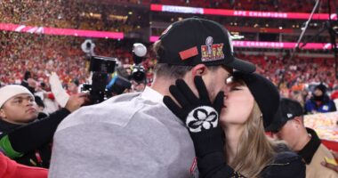 Taylor Swift Kisses and Cuddles Travis Kelce on Field After Chiefs Win