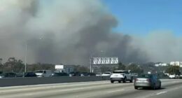 Terrified residents trapped in gridlock traffic as they try to escape LA wildfires after flames surround celeb enclave